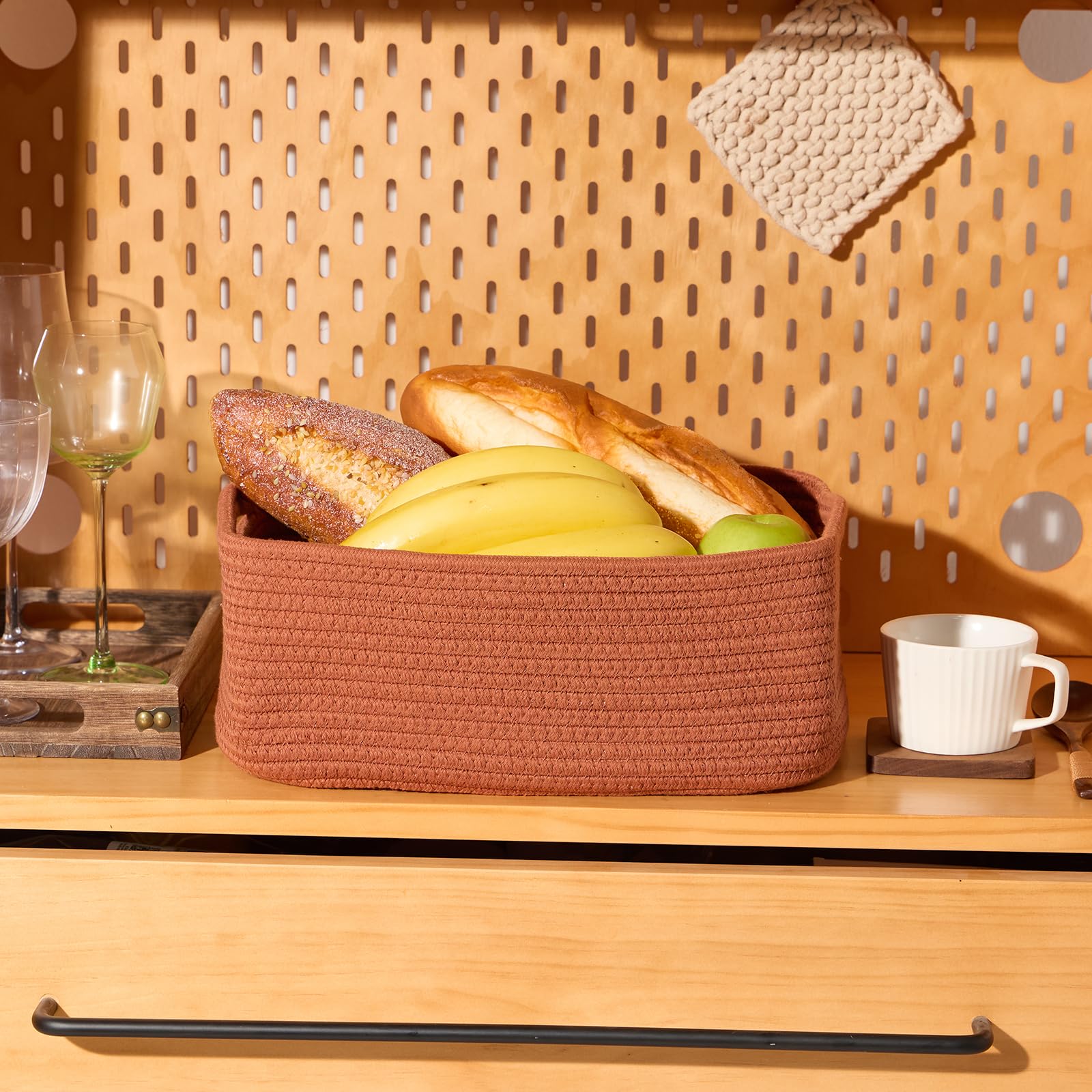 MiniArk oxide red living room display basket adds warmth and texture.