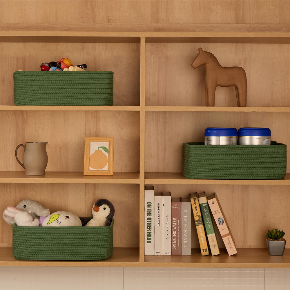 MiniArk basket towel and blanket storage in green keeps essentials organized.