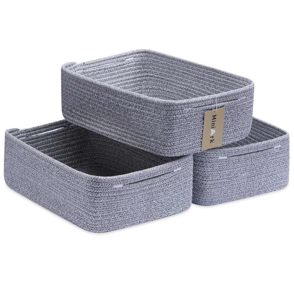 MiniArk large shallow basket in a bathroom holding towels for easy storage.