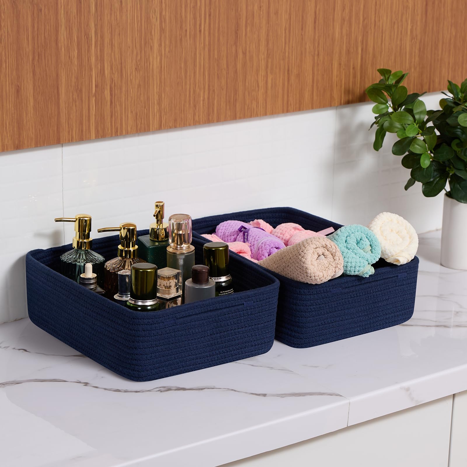 MiniArk navy-blue baskets shown with baby essentials, highlighting soft, safe nursery use.
