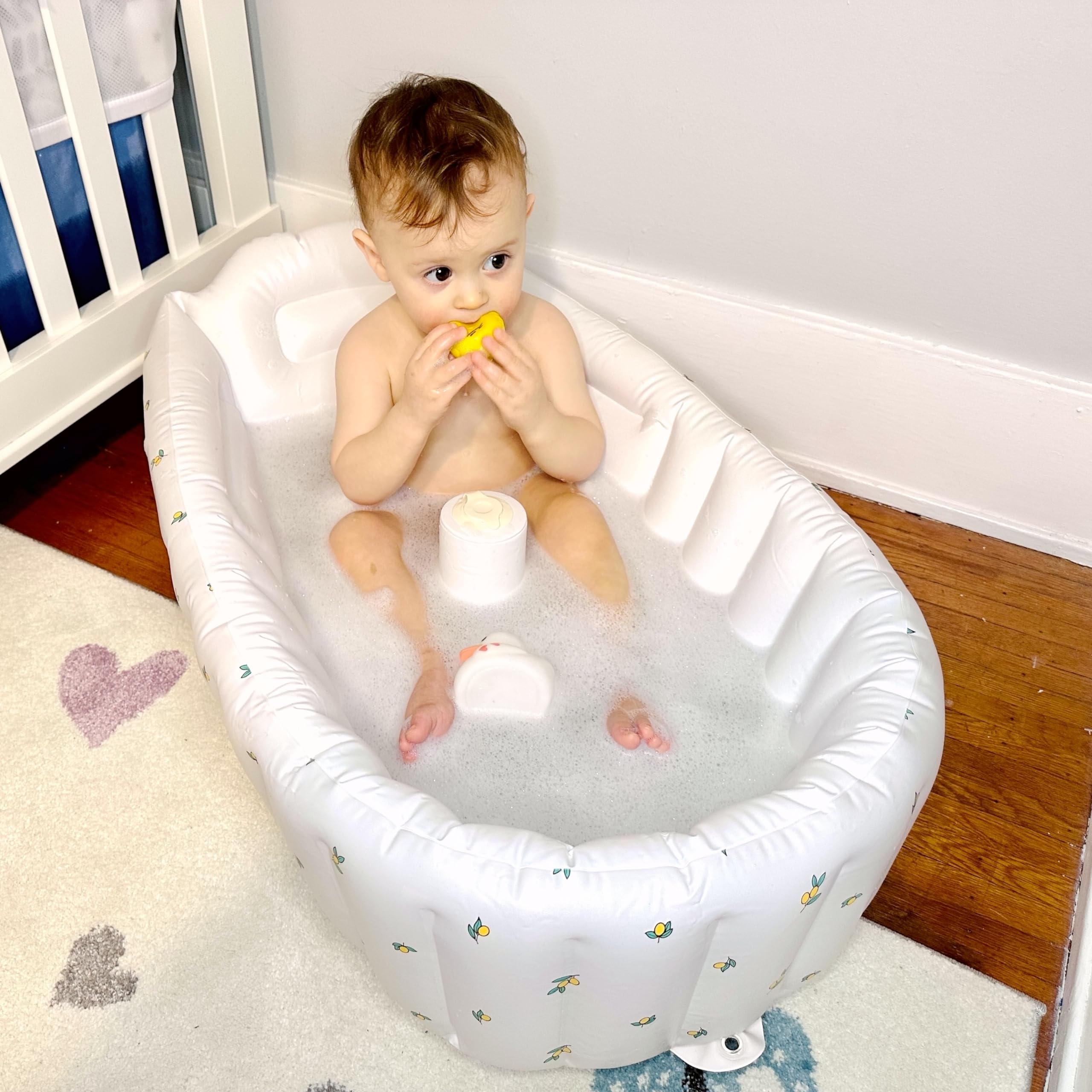 Mink inflatable bath tub Olive back support provides comfortable toddler baths.