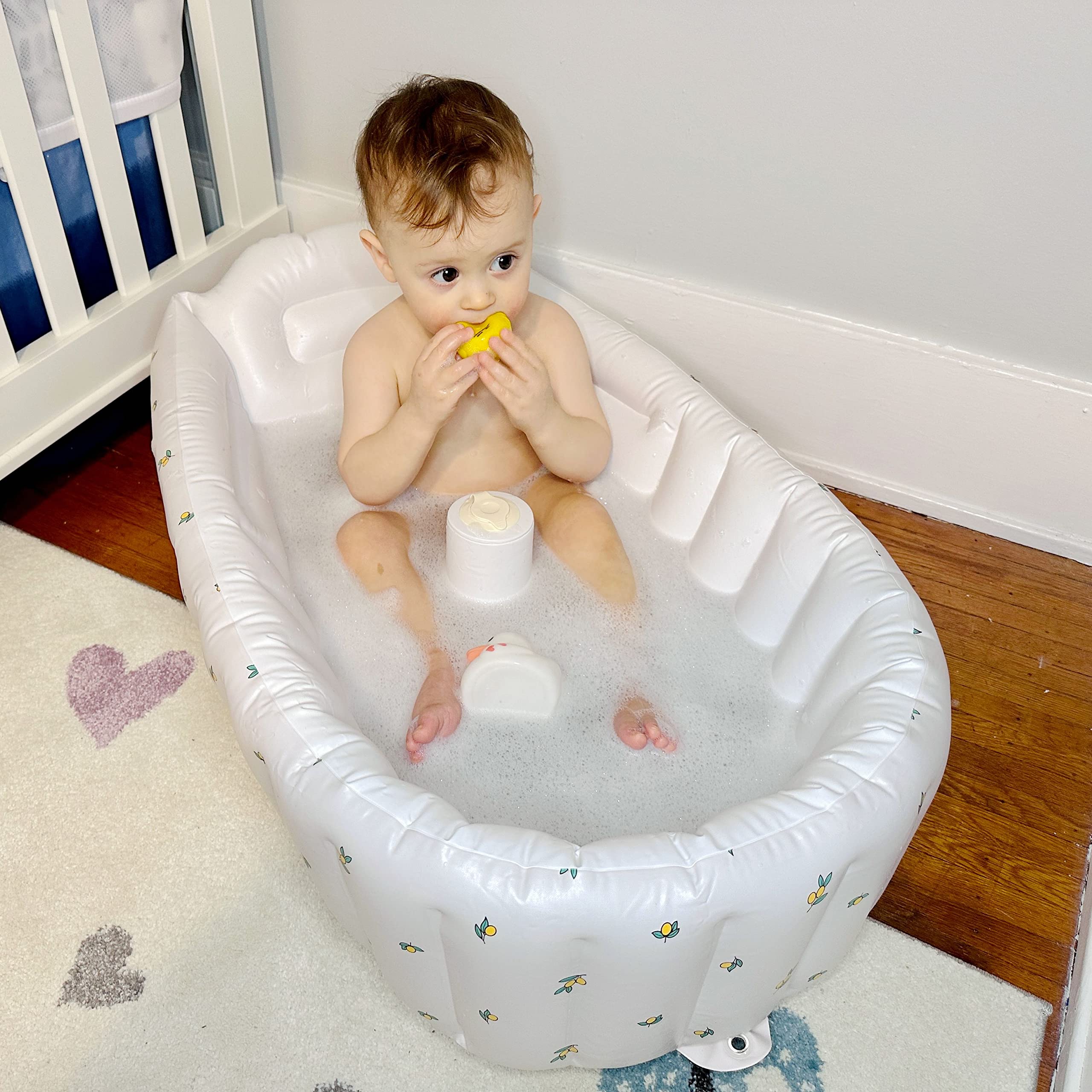MINK bathtub folds flat for compact easy storage after bath