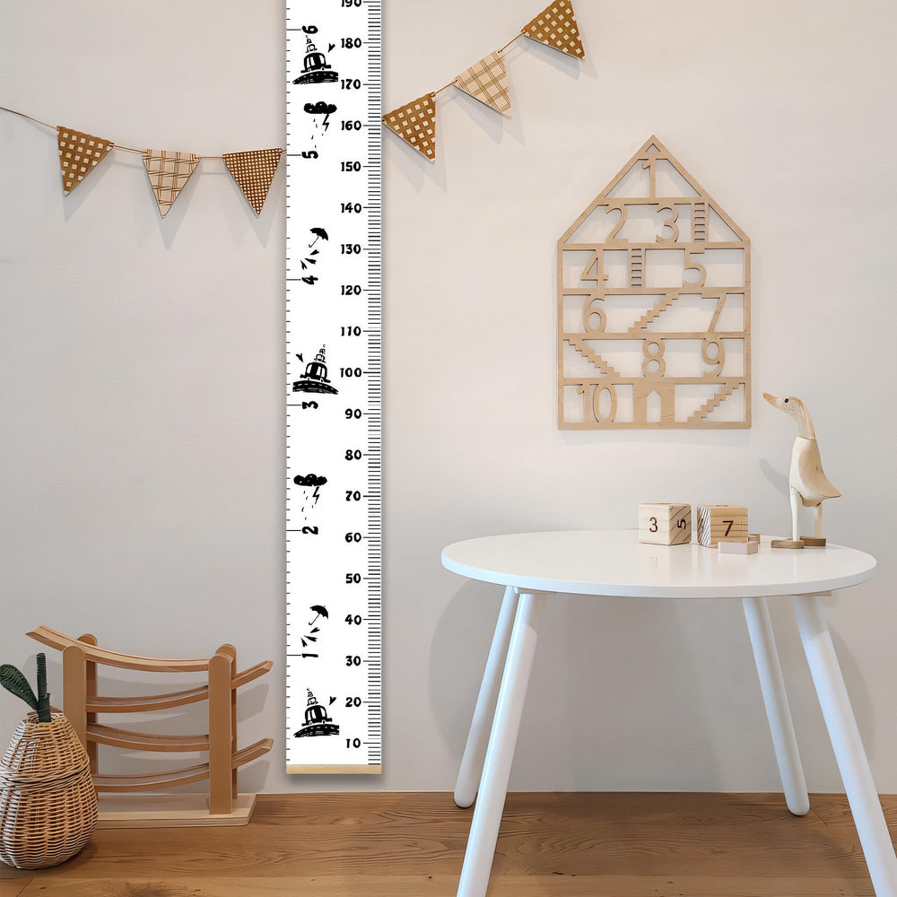 MinoMia growth chart black frame adds stylish room decor.