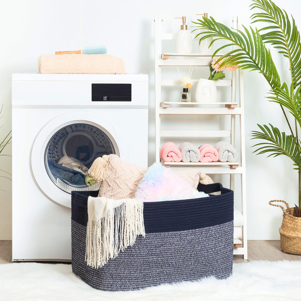 Mintwood Design 22in navy blanket basket in living room with towels for tidy storage
