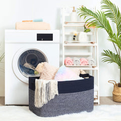 Mintwood Design 22in navy blanket basket in living room with towels for tidy storage