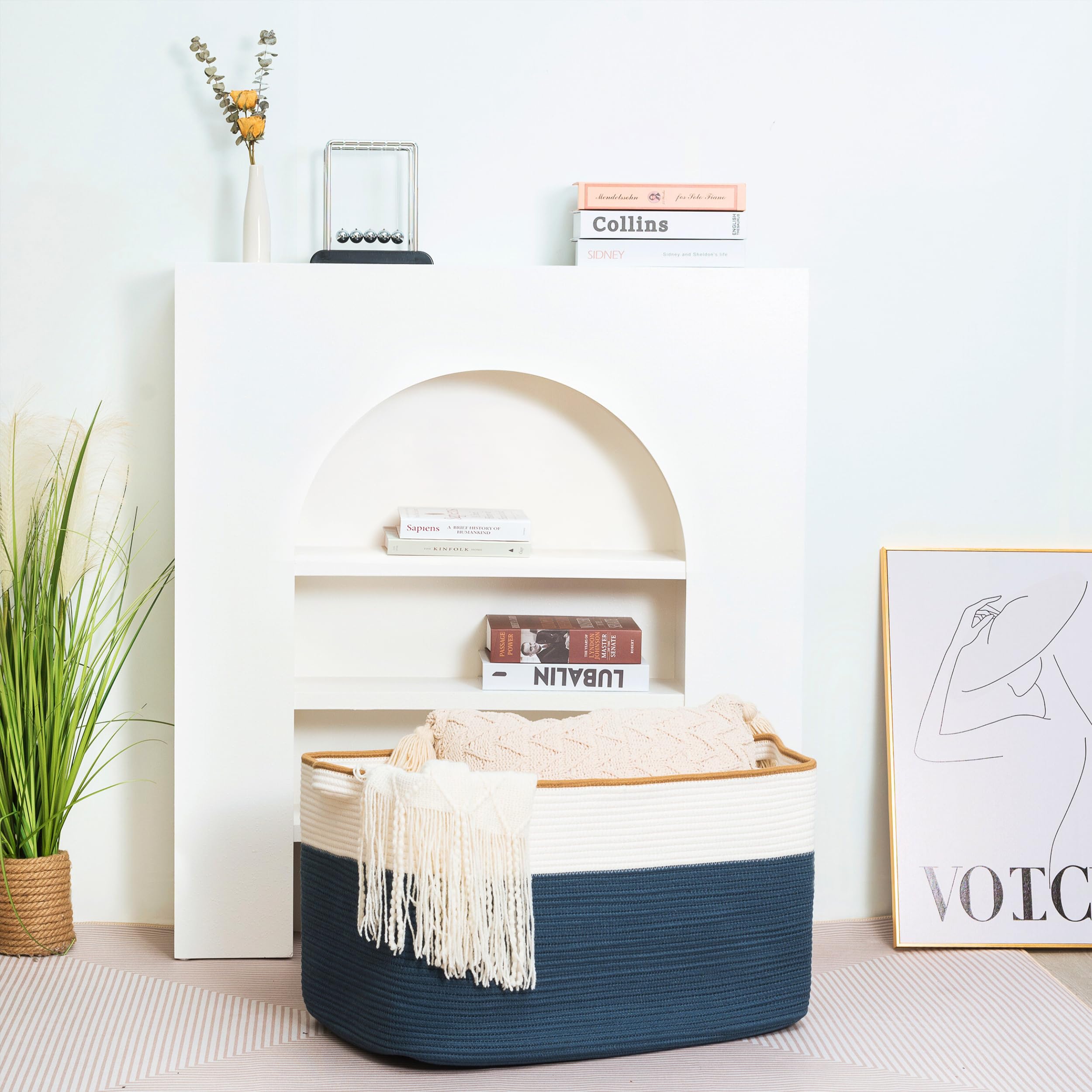 Mintwood Design 22in navy blanket basket by the door with pool towels at entry