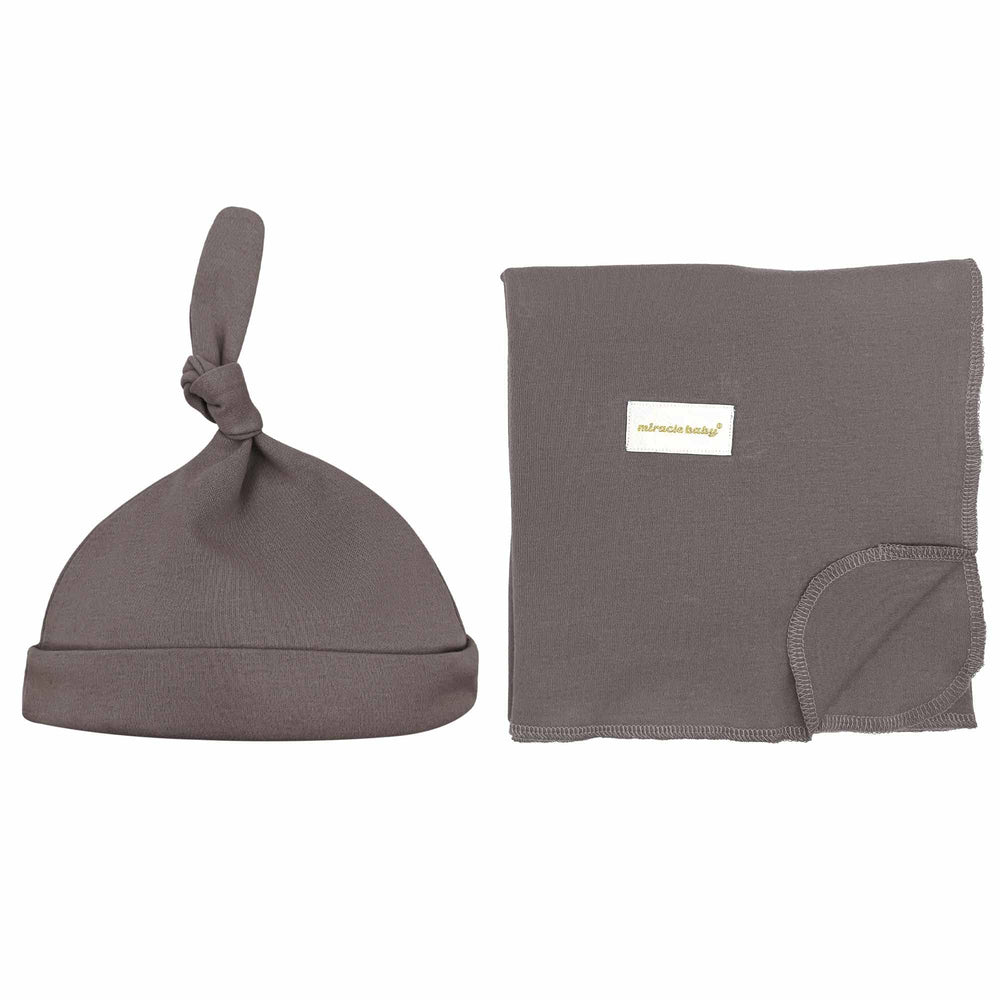 Miracle Baby swaddle blanket close-up highlights ultra-soft cotton for gentle warmth and skin comfort.