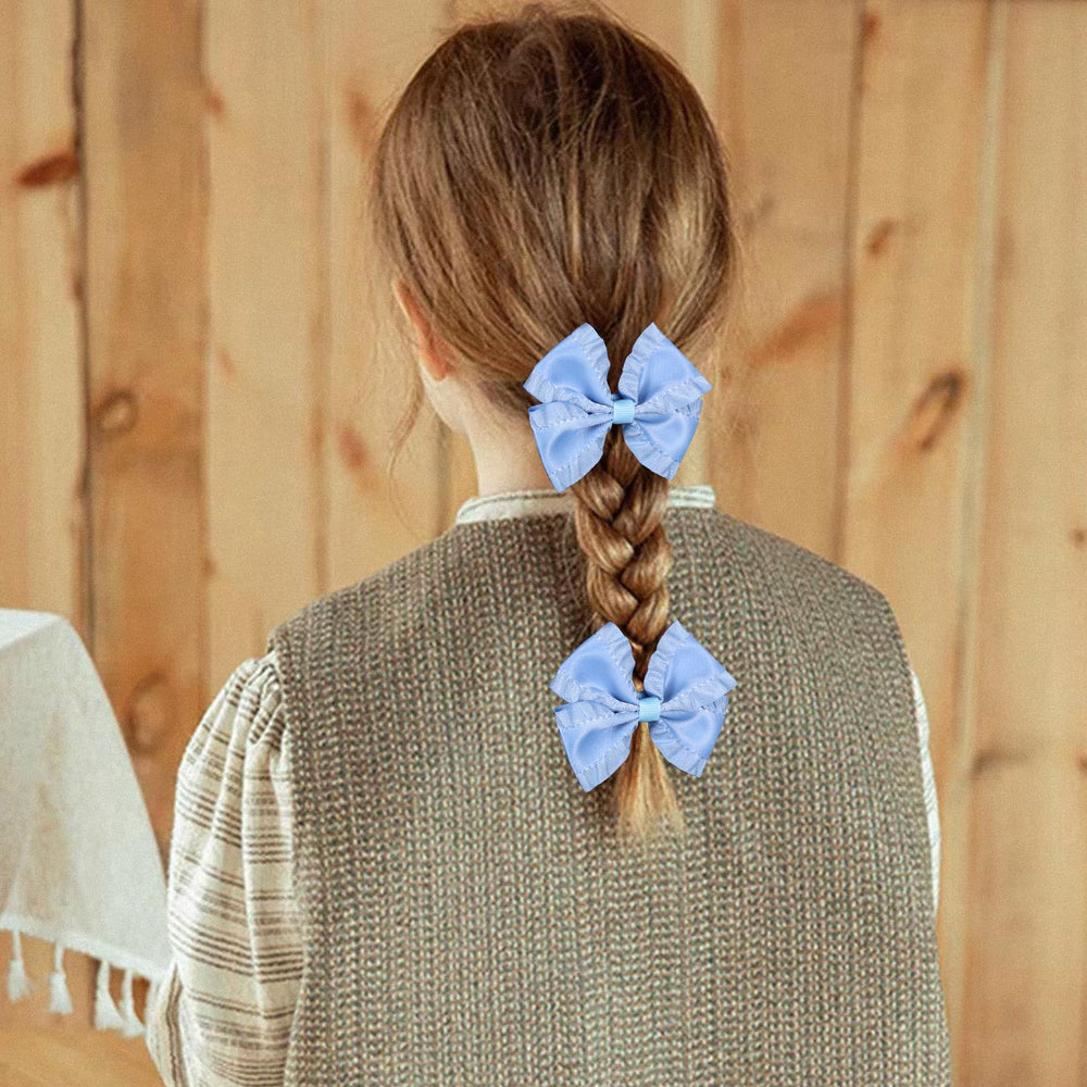 Miroksh ruffled satin bow clip glides easily into hair without pulling.