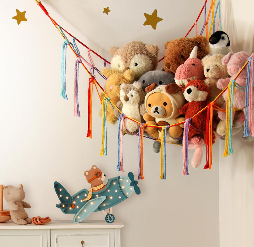 Mirolam macrame toy hammock mounted for colorful boho wall decor.