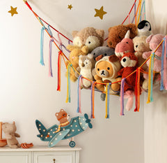 Mirolam macrame toy hammock mounted for colorful boho wall decor.