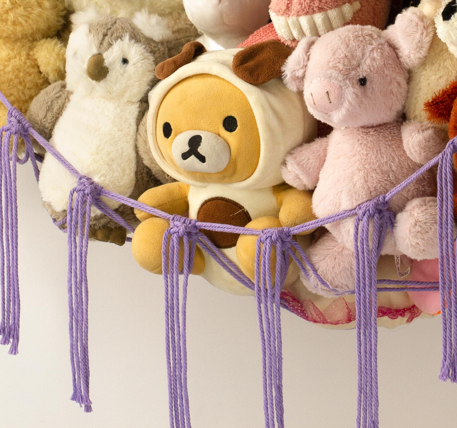 Mirolam plush storage hammock in kids' room highlights decorative bohemian style