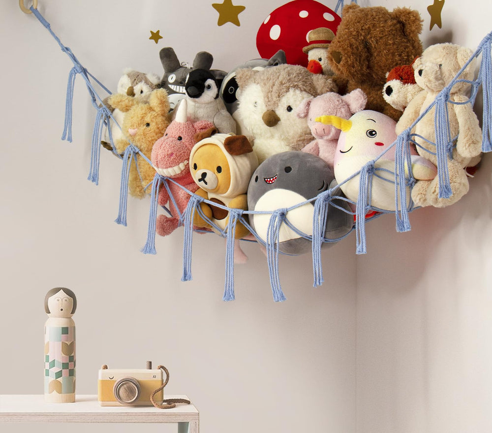 Mirolam blue hammock hanging in a bedroom enhances decor while tidying toys