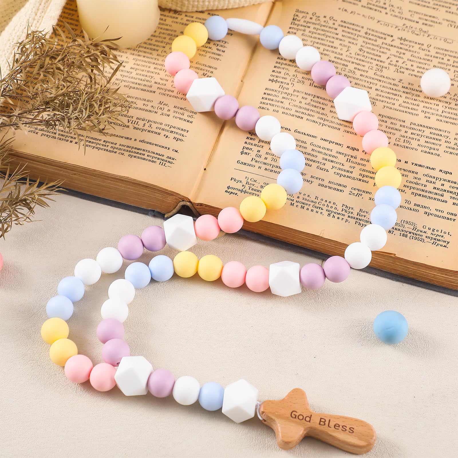Close-up of 15 mm silicone beads from the Misdary rosary, comfortable for little hands.