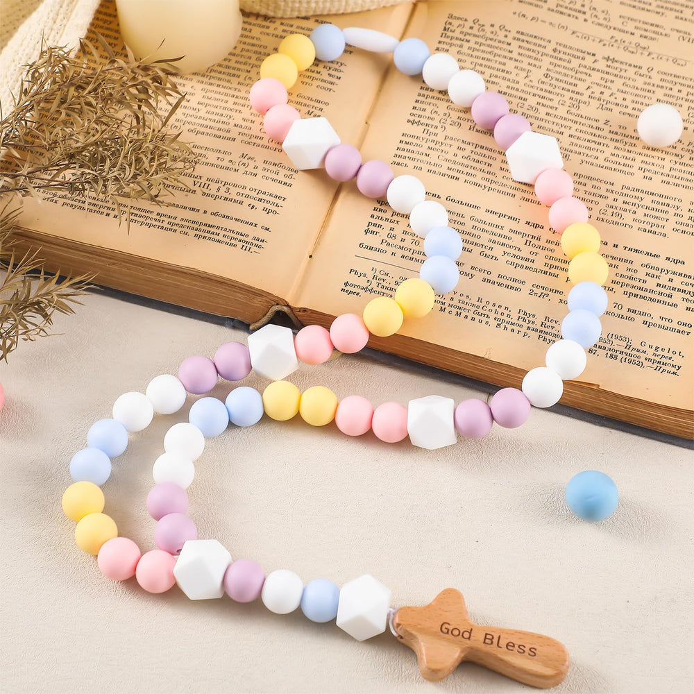 Close-up of 15 mm silicone beads from the Misdary rosary, comfortable for little hands.