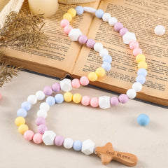 Close-up of 15 mm silicone beads from the Misdary rosary, comfortable for little hands.
