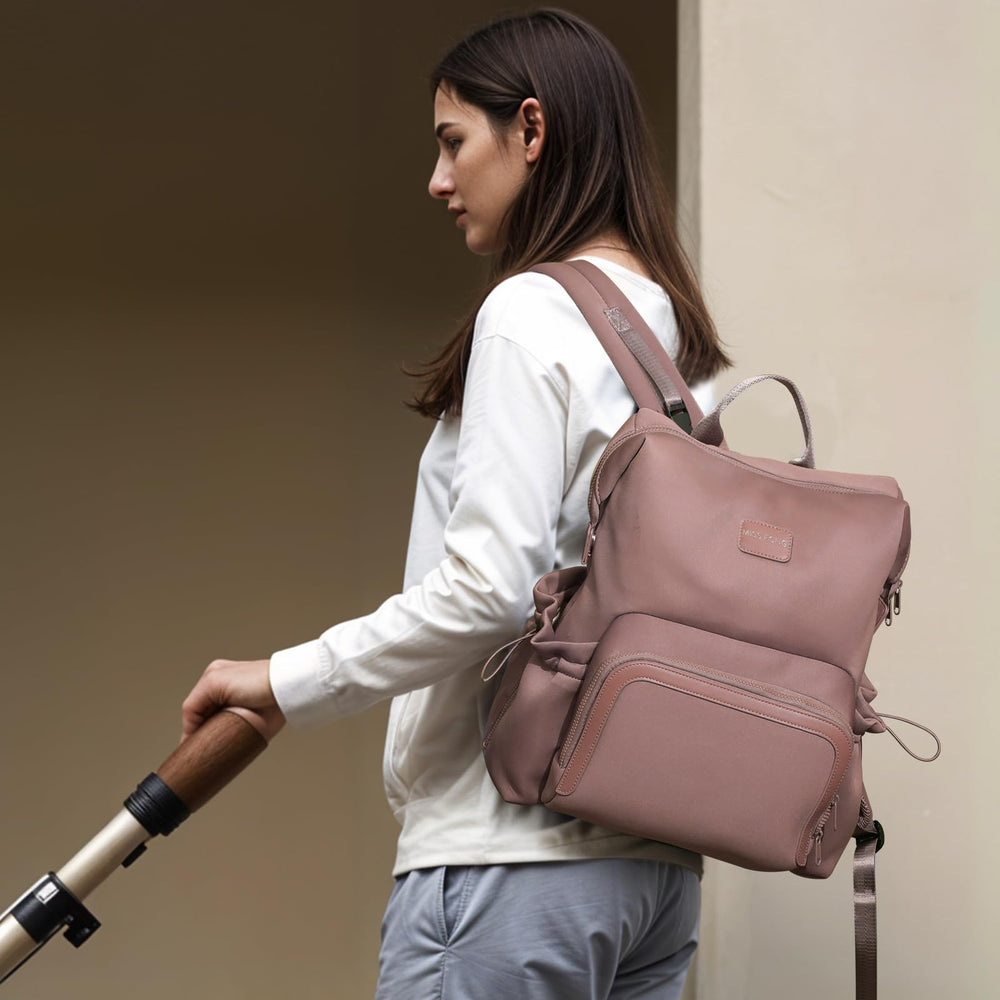Miss Fong diaper bag backpack includes a washable changing pad for on-the-go changes