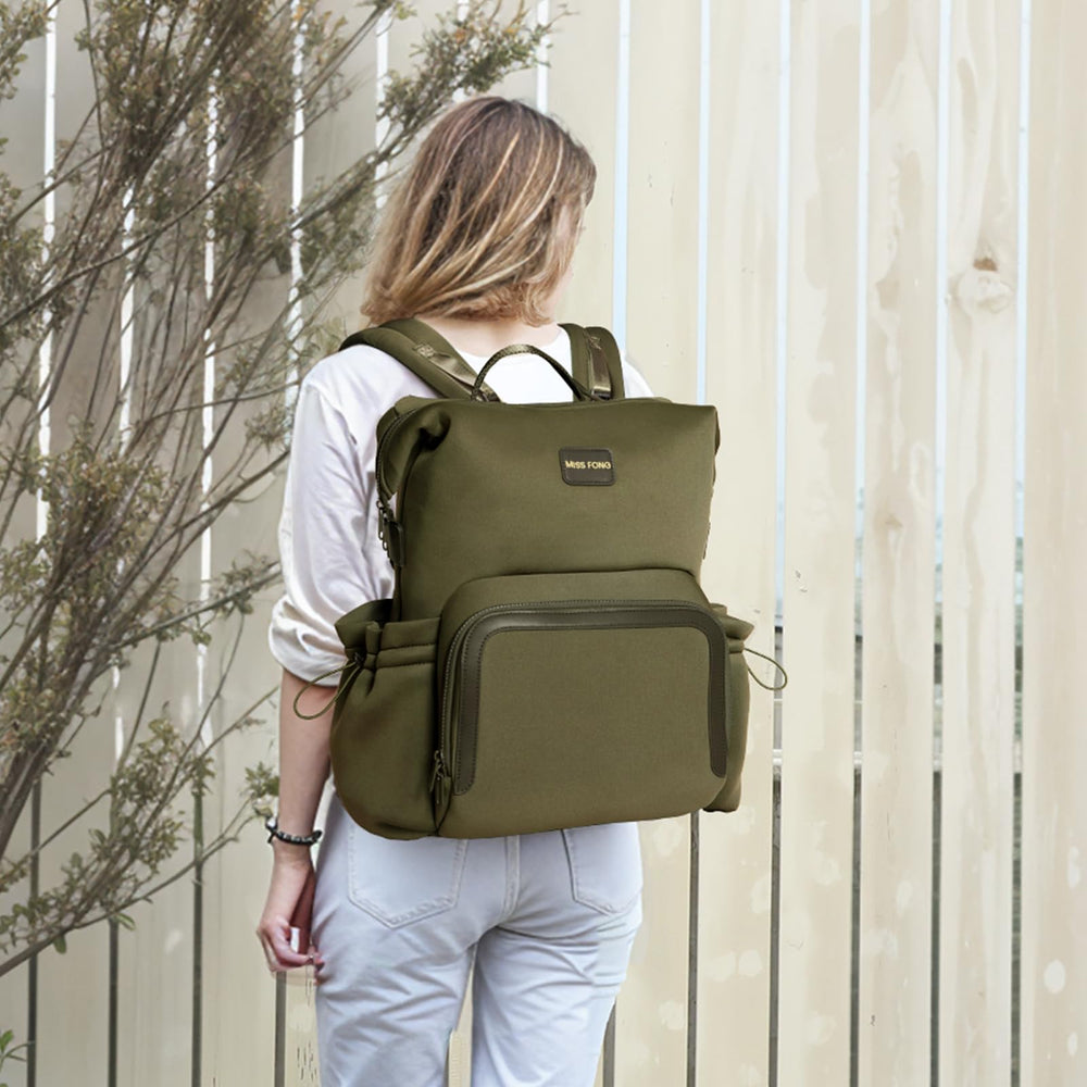 miss fong diaper bag backpack green twelve-pocket layout keeps baby gear organized.