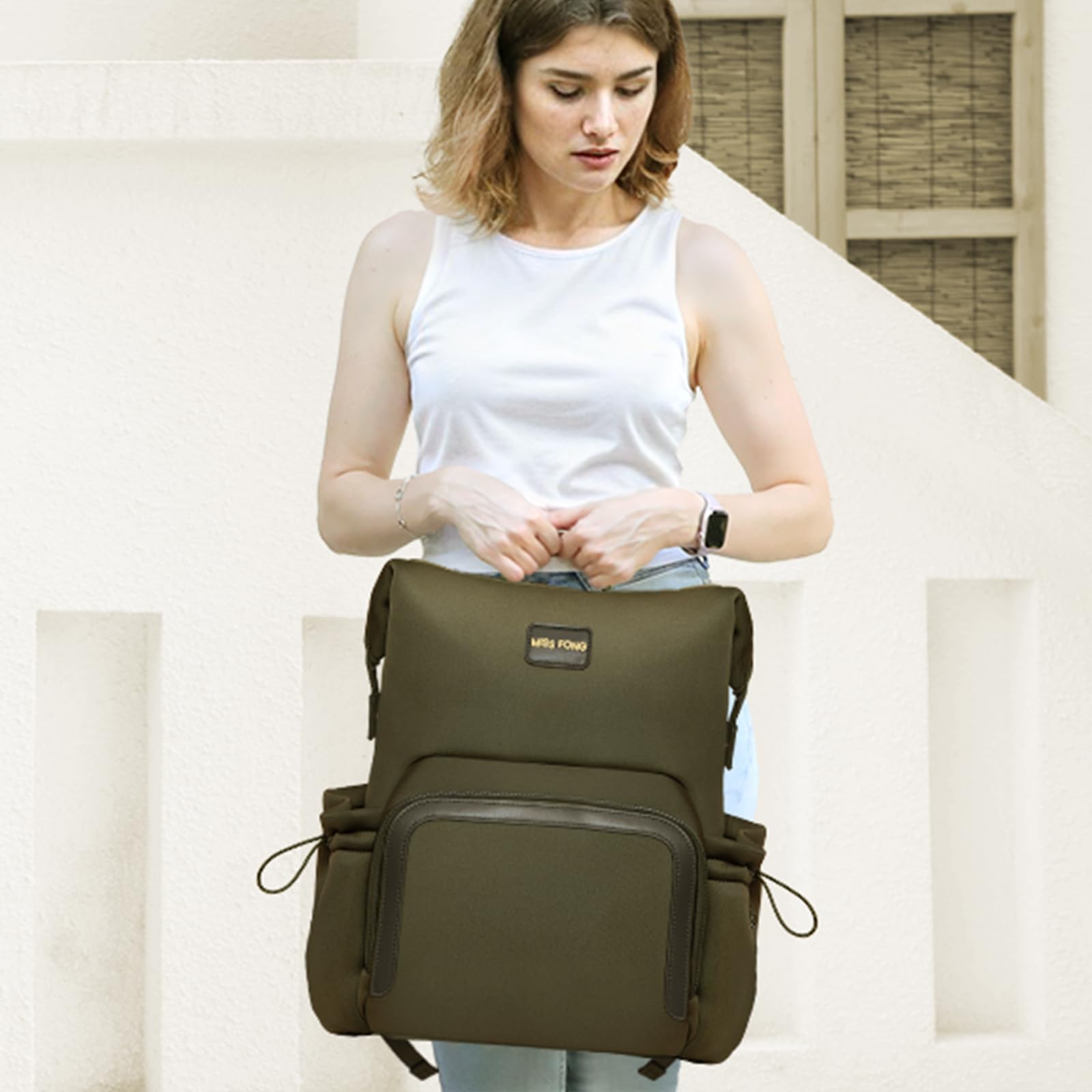miss fong diaper bag backpack green waterproof nylon lining protects contents.