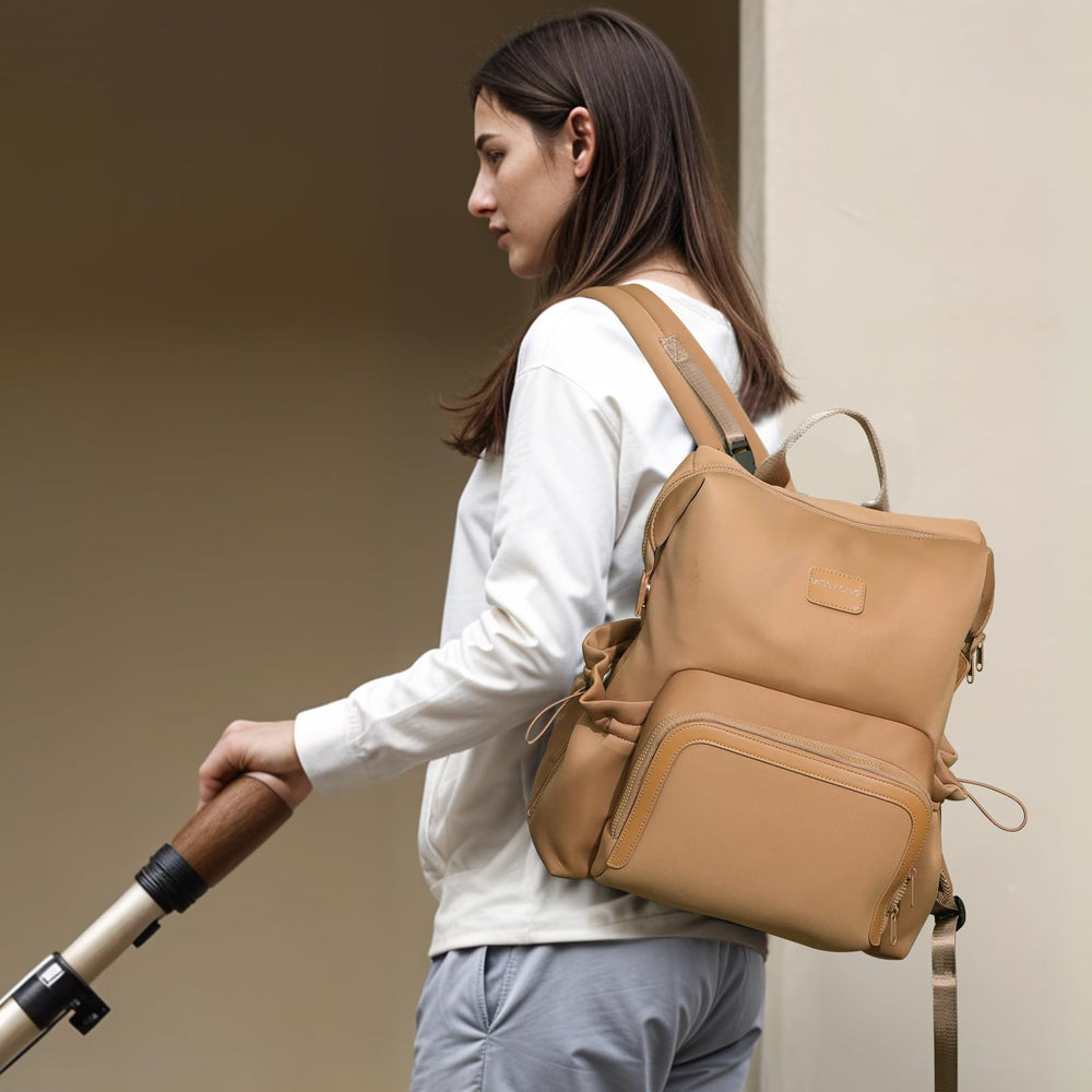 Miss Fong diaper bag backpack luggage sleeve helps travel with ease through airports.