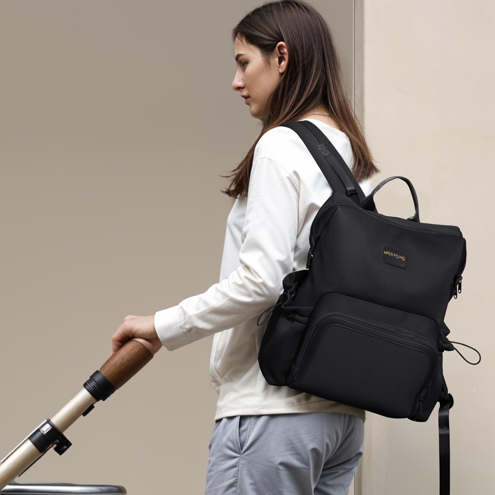 Miss Fong neoprene material highlights durability and soft texture for everyday use.
