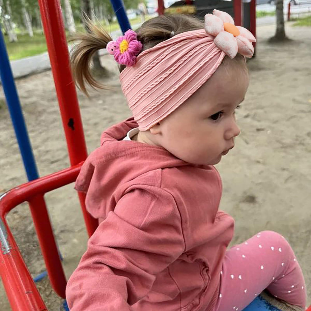MIUXUESO nylon headband showing stretch, perfect for growing baby from newborn to toddler.
