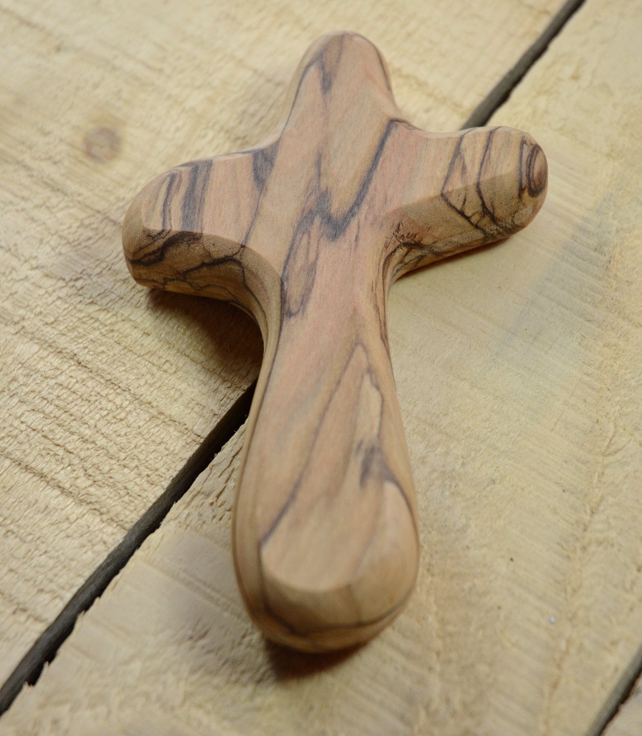 MIZZE prayer cross in hand captures portable spiritual reminder