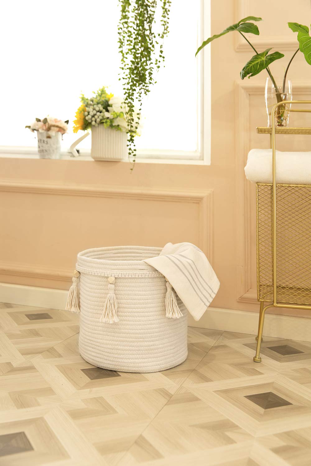 Mkono macrame basket nursery toy storage keeps toys tidy and accessible.