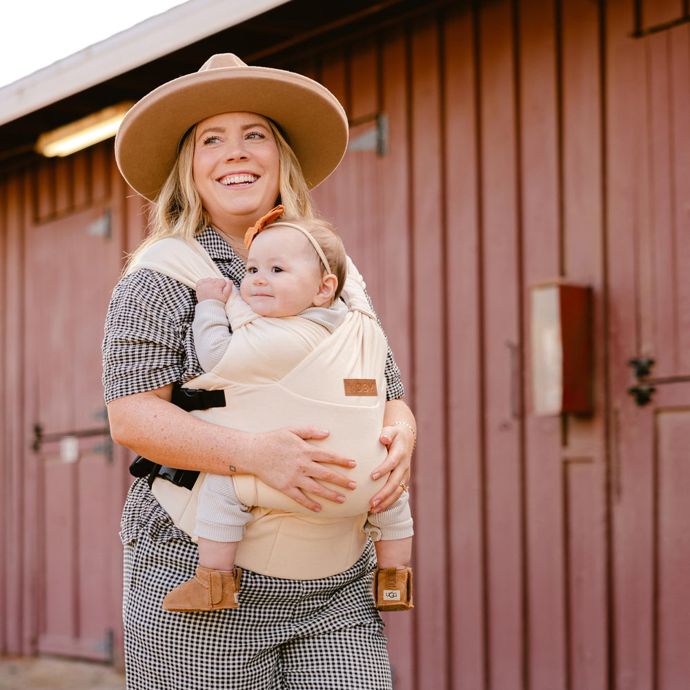 Moby Baby Duet Carrier used by mom and dad for hands-free bonding.