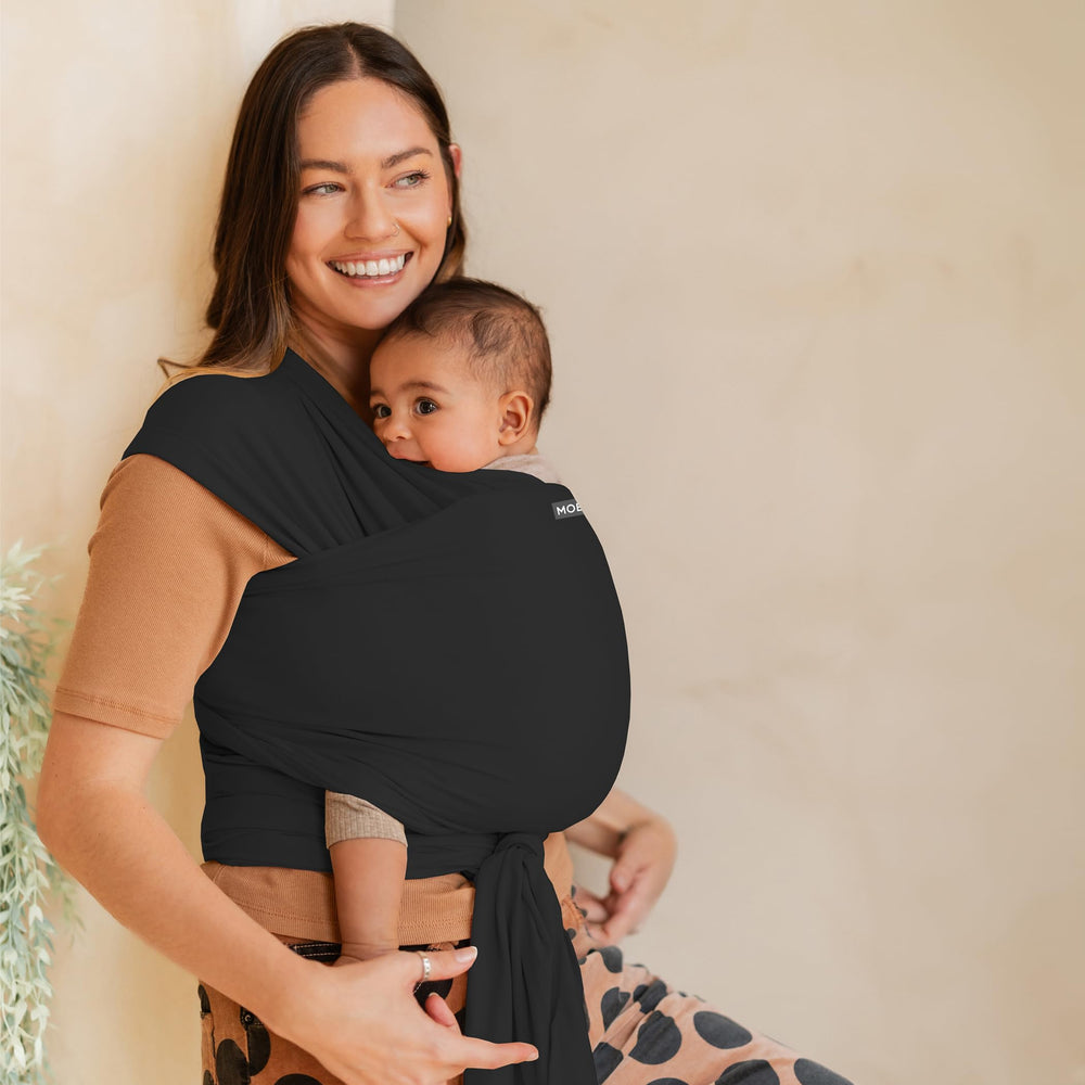 Moby Basics wrap worn in hip carry supports hands-free errands.
