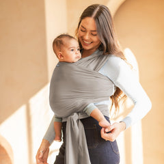 Moby Basics Wrap supporting a newborn in an 8-33 lbs range with versatile carry options.