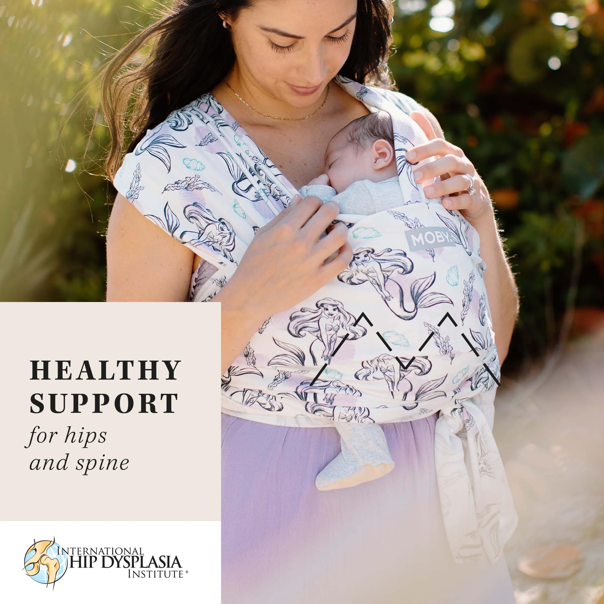 Moby Featherknit worn-infant image shows secure position for cozy hands-free bonding.