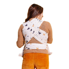 Moby Featherknit wrap worn on torso demonstrates hands-free support for on-the-go parents.