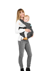 Moby hip seat carrier in grey setup enables hands-free comfort during daily tasks.