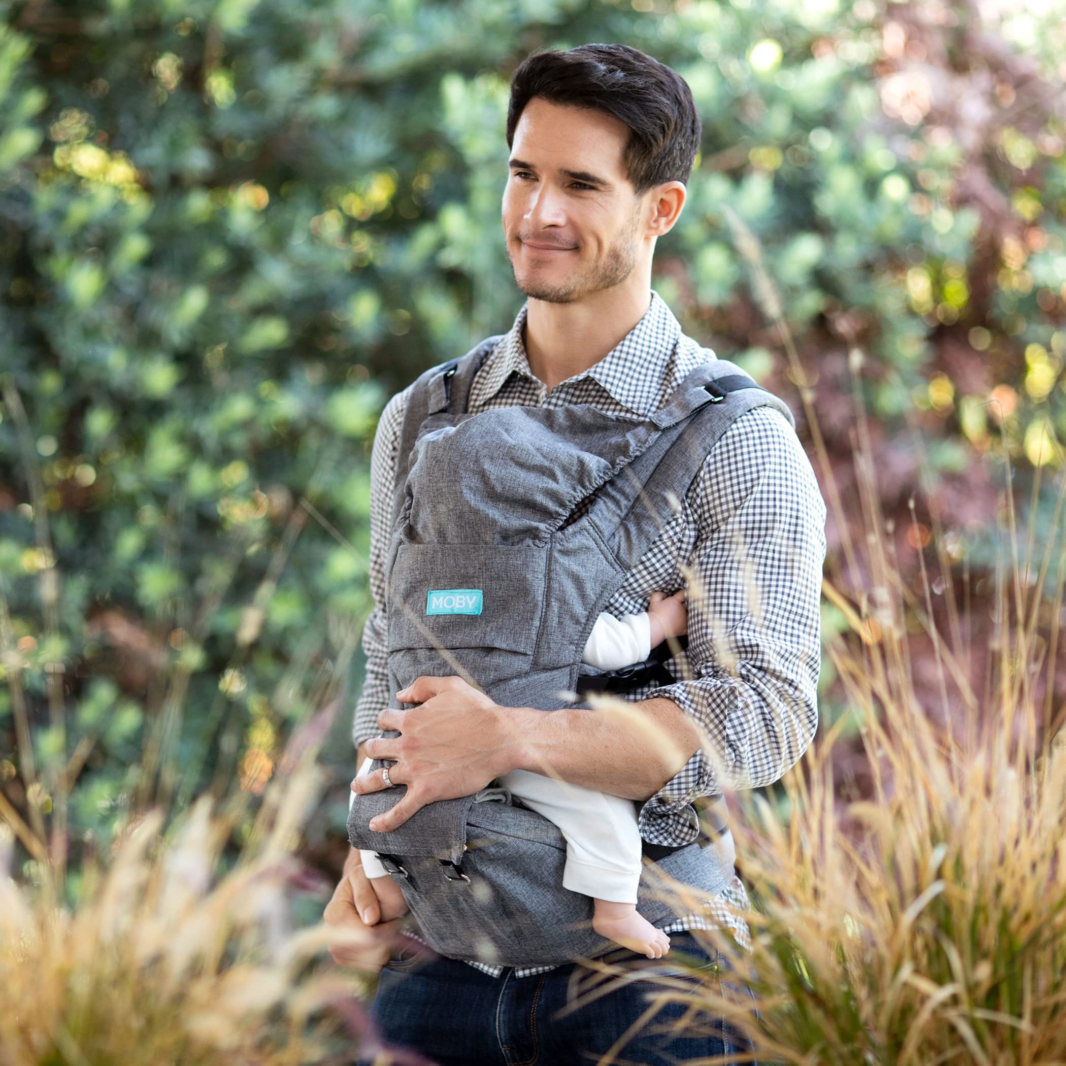 Moby hip seat demonstrates seven wearing styles for growing infants and toddlers.