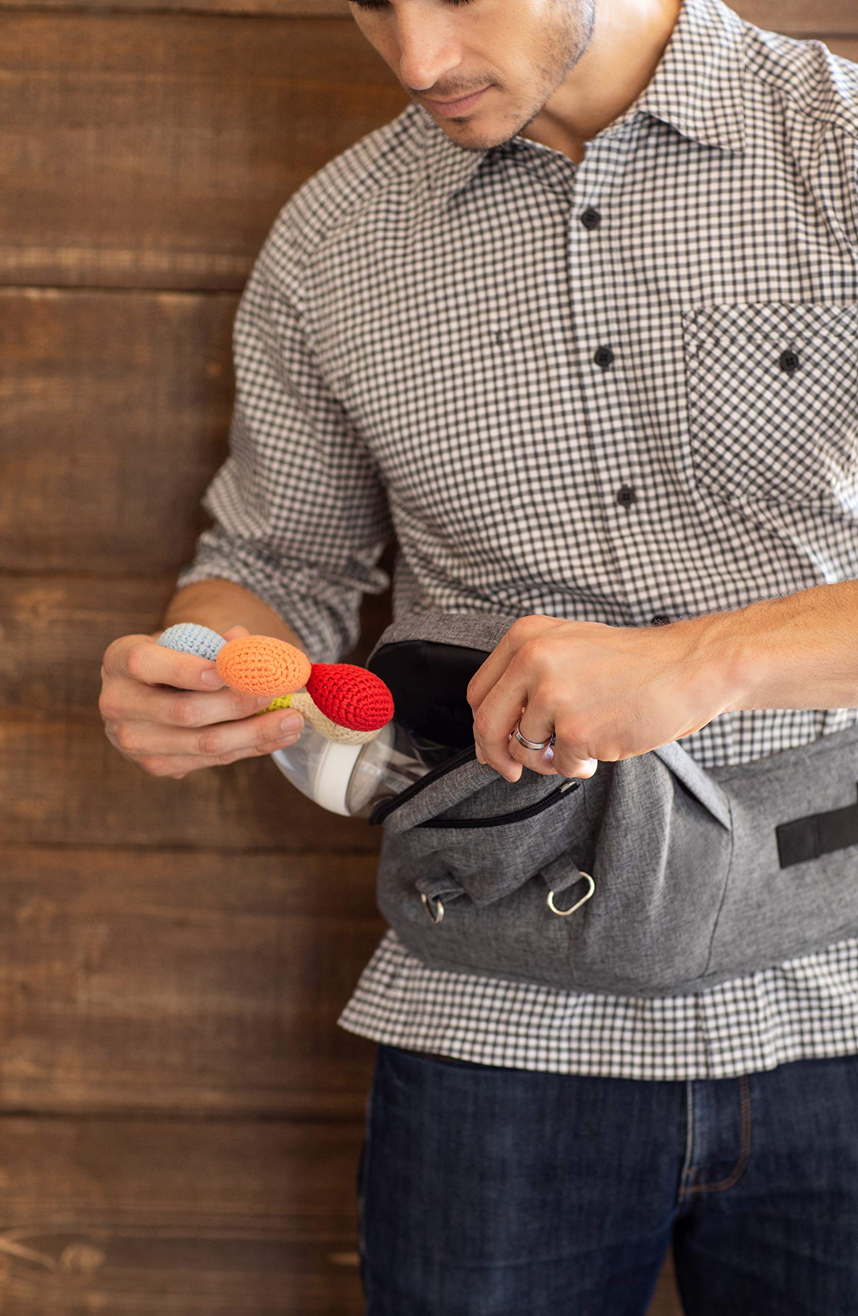 Moby hip seat offers accessible pockets for essential items on the go.