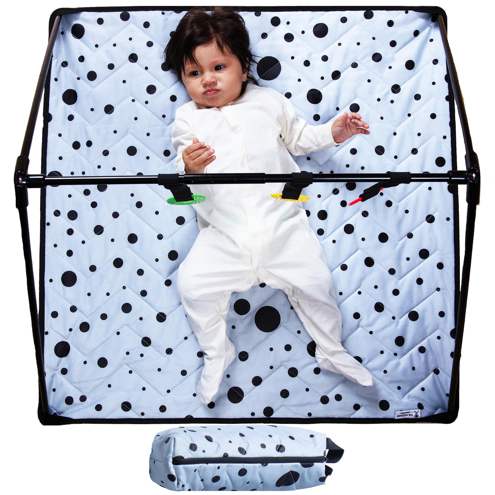 The Modern Ohana travel baby play mat folding in action for quick setup.