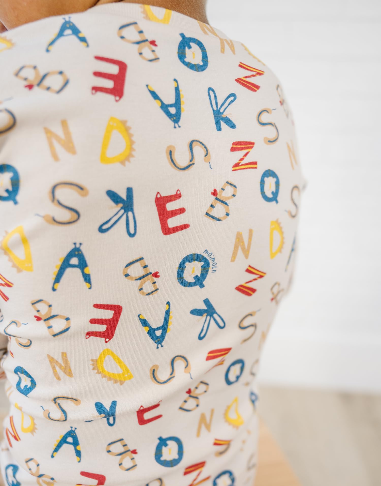 moimoln Alphabet Buddies beige stretch fabric supports playful movement