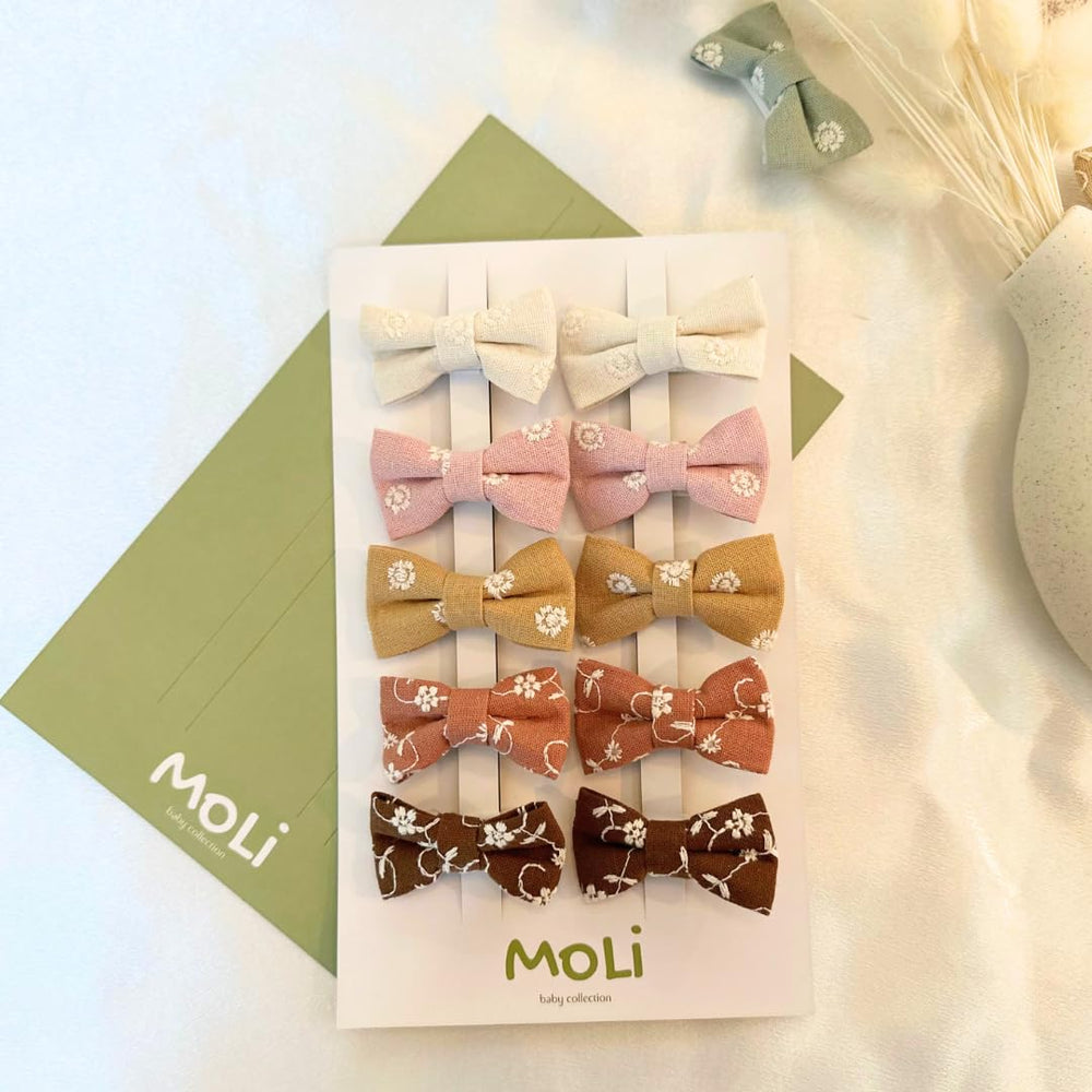 MoLi Baby Collection 10-piece floral bow clips in autumn tones for easy daily styling.