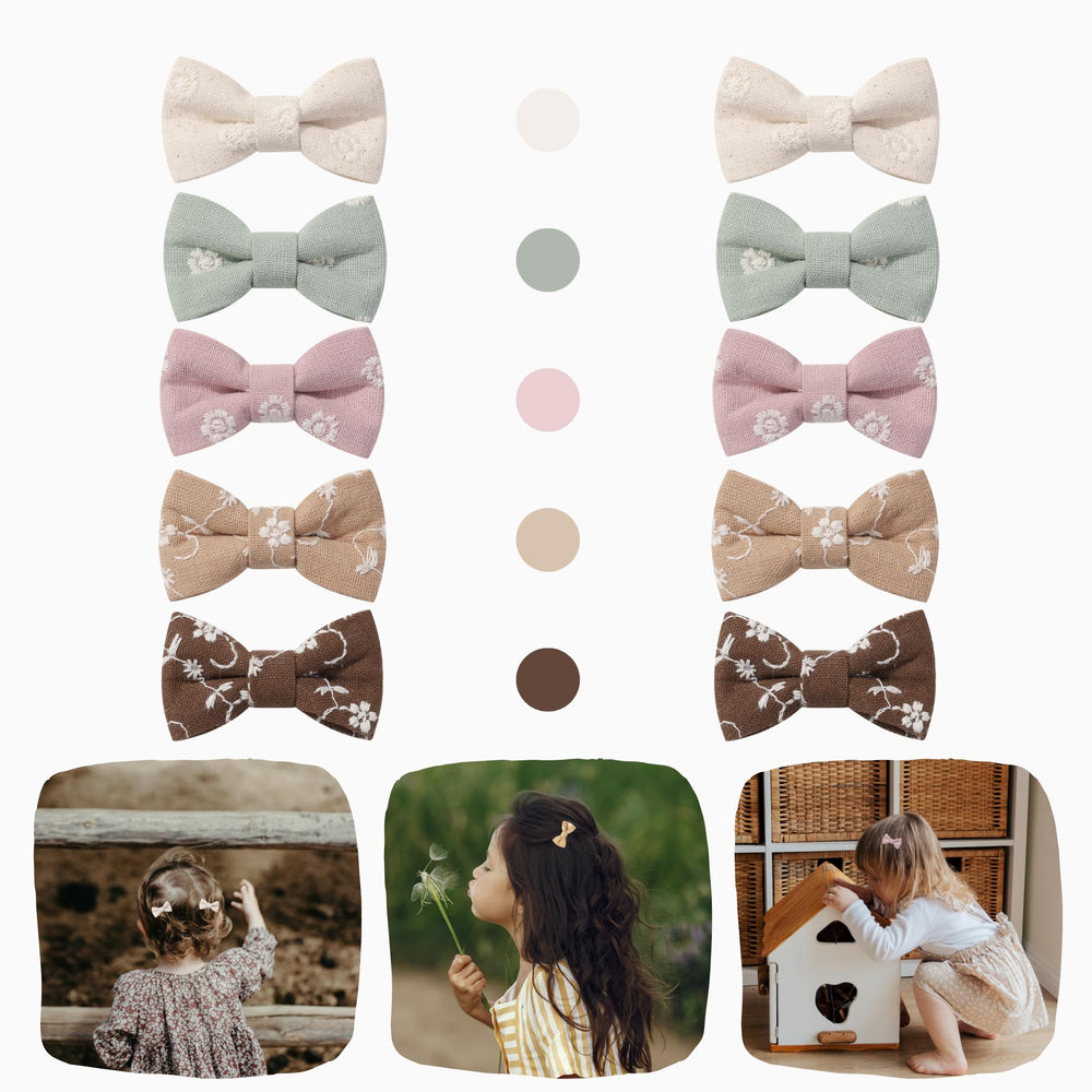 MoLi Baby Collection floral embroidery closeup highlights refined detailing on 2-inch bows.