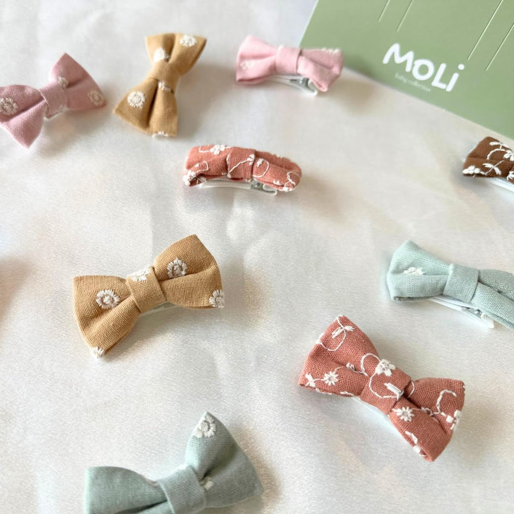 MoLi Baby Collection soft clasps protect fine baby hair during daily wear.