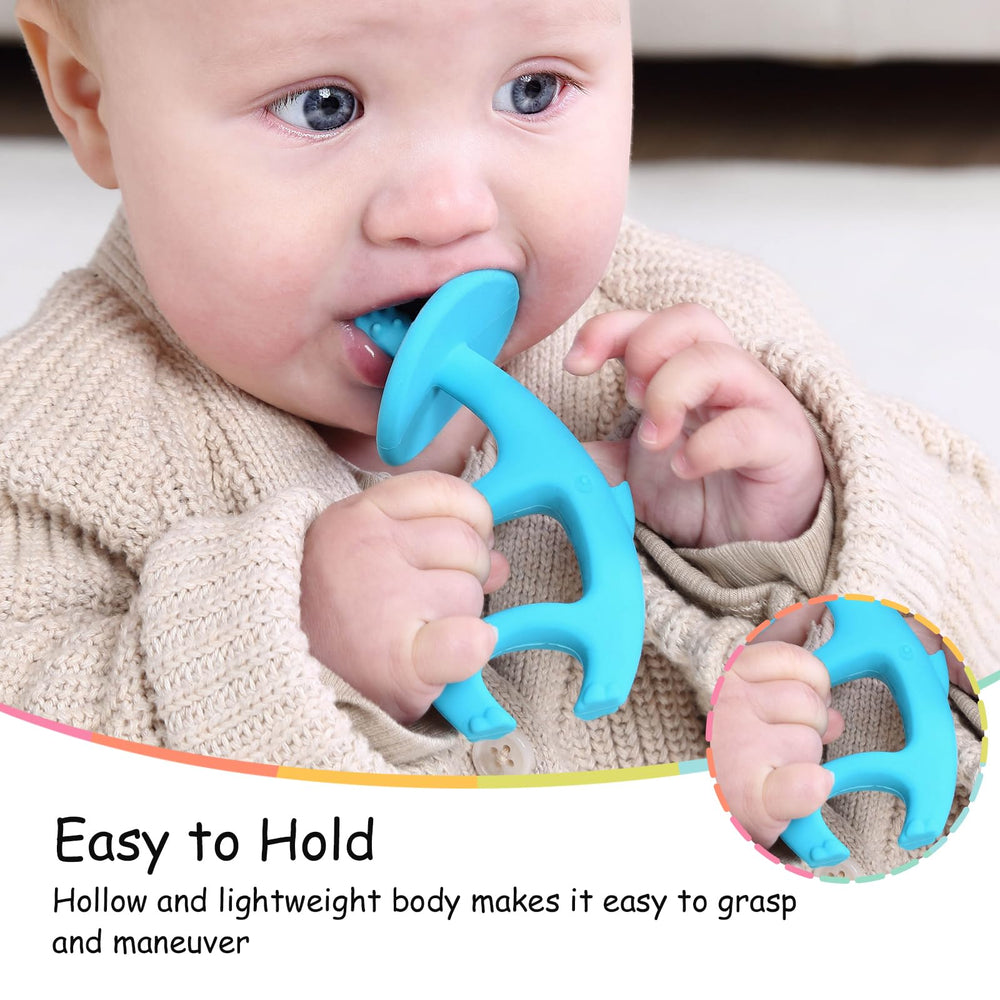 Mombella Elephant Teether clip attached to clothing for on-the-go soothing