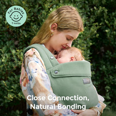 Momcozy baby carrier shows ergonomic waist strap for back support during long wears
