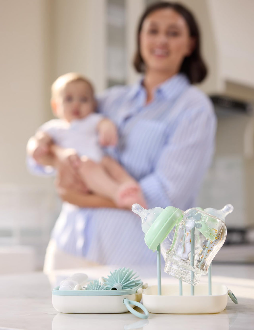 Momcozy baby items cleaner for teether and pacifier-safe cleaning.