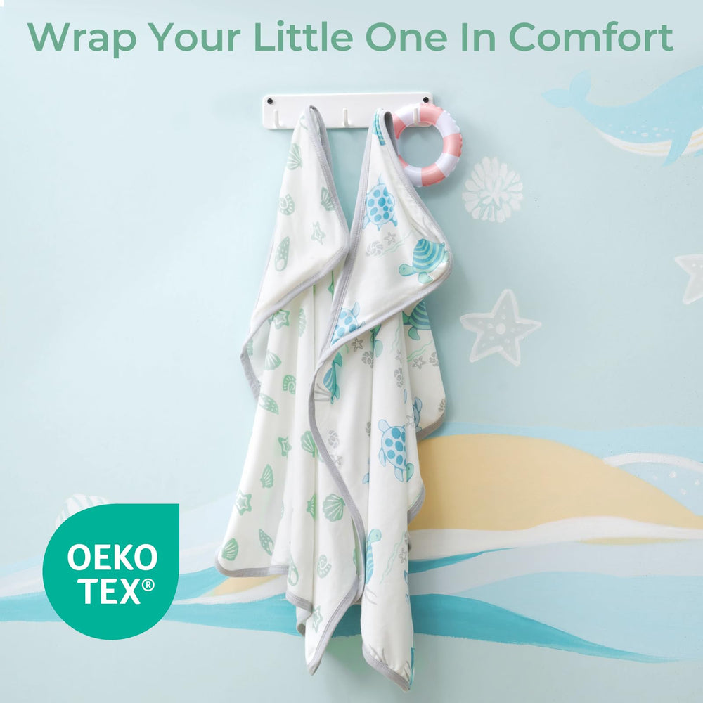 Momcozy towel patterns in vibrant sea turtle design support visual development.