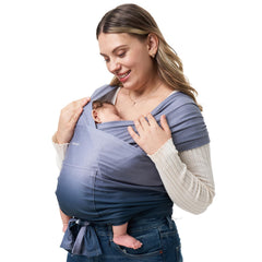 Momcozy baby wrap carrier worn by model for hands-free comfort.
