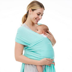 Momcozy baby wrap in lake blue worn for comfortable on-the-go babywear.