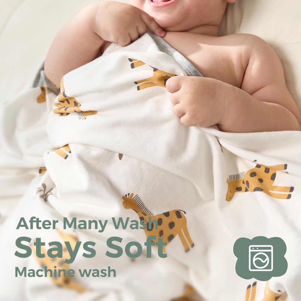 Momcozy Best Wishes hooded towel wrapped around baby for a snug bath time