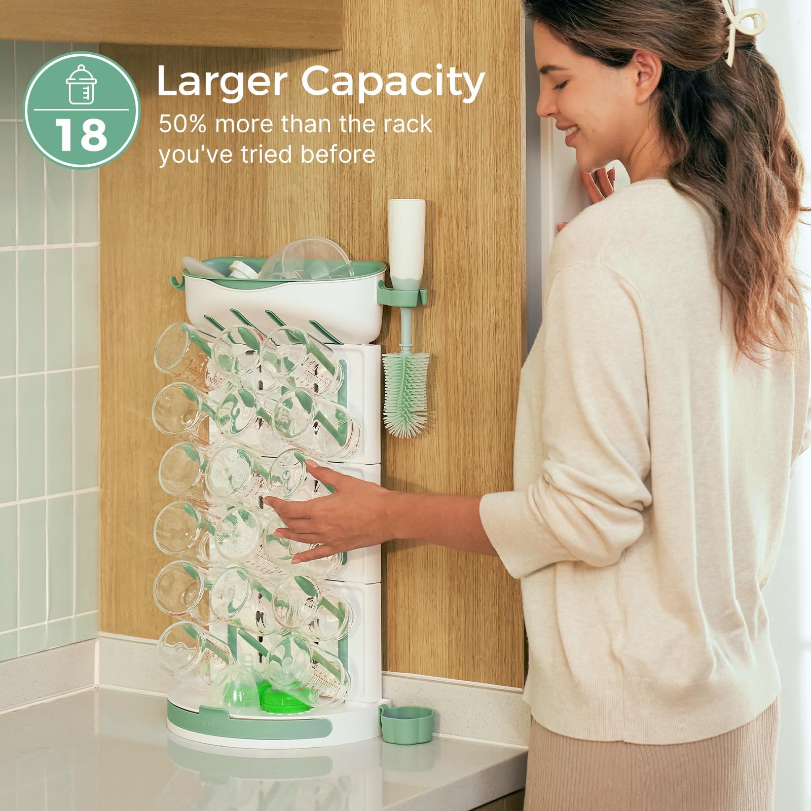 Momcozy bottle drying rack showing nipples and pump-parts area for easy access