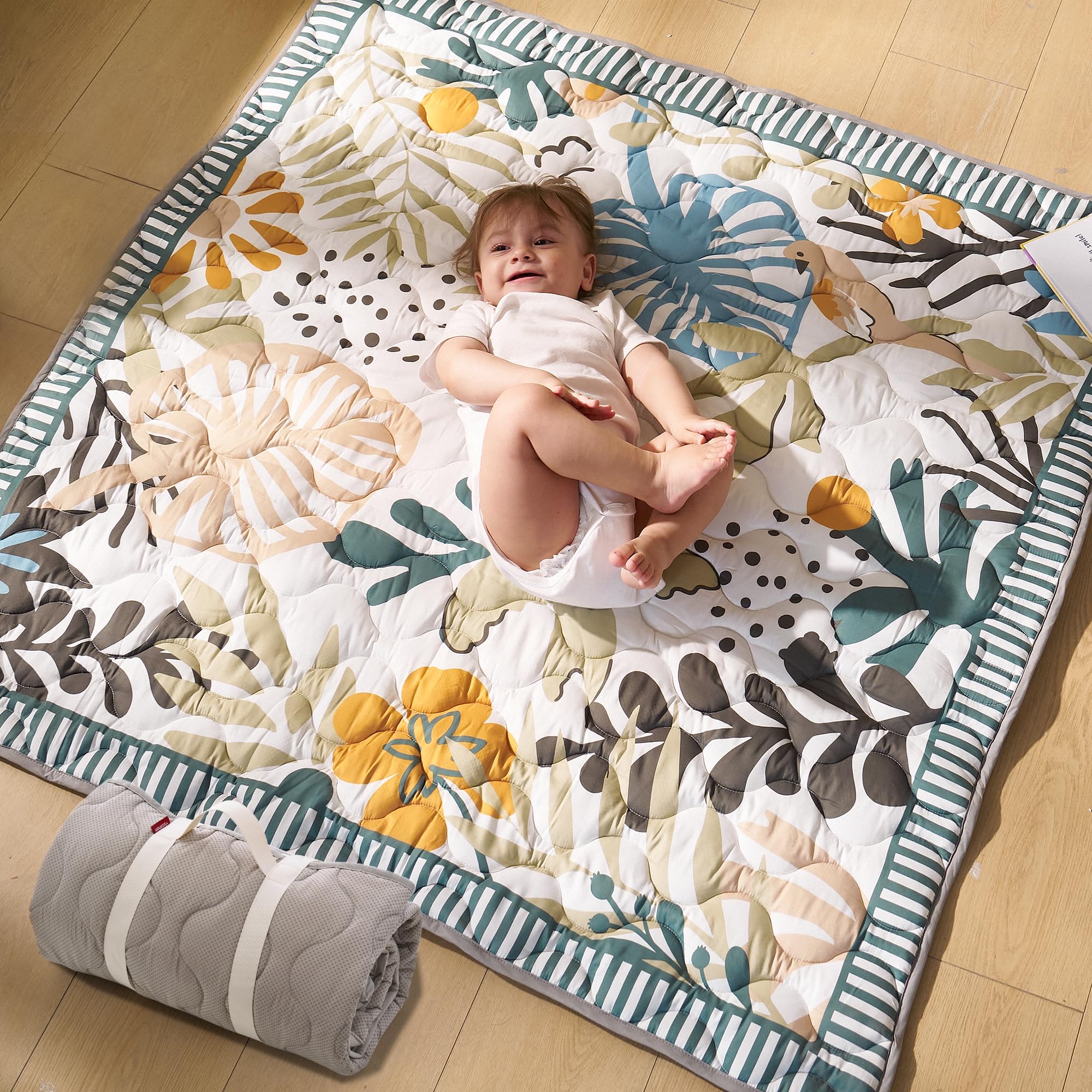Momcozy Forest World play mat laid out for spacious tummy time and safe crawling.
