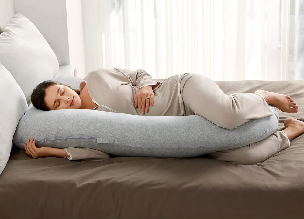 Momcozy full length pregnancy pillow shows contouring for back and belly comfort.